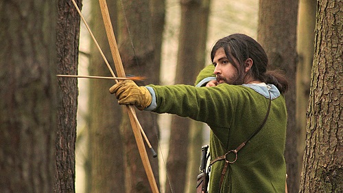 An archer looses an arrow