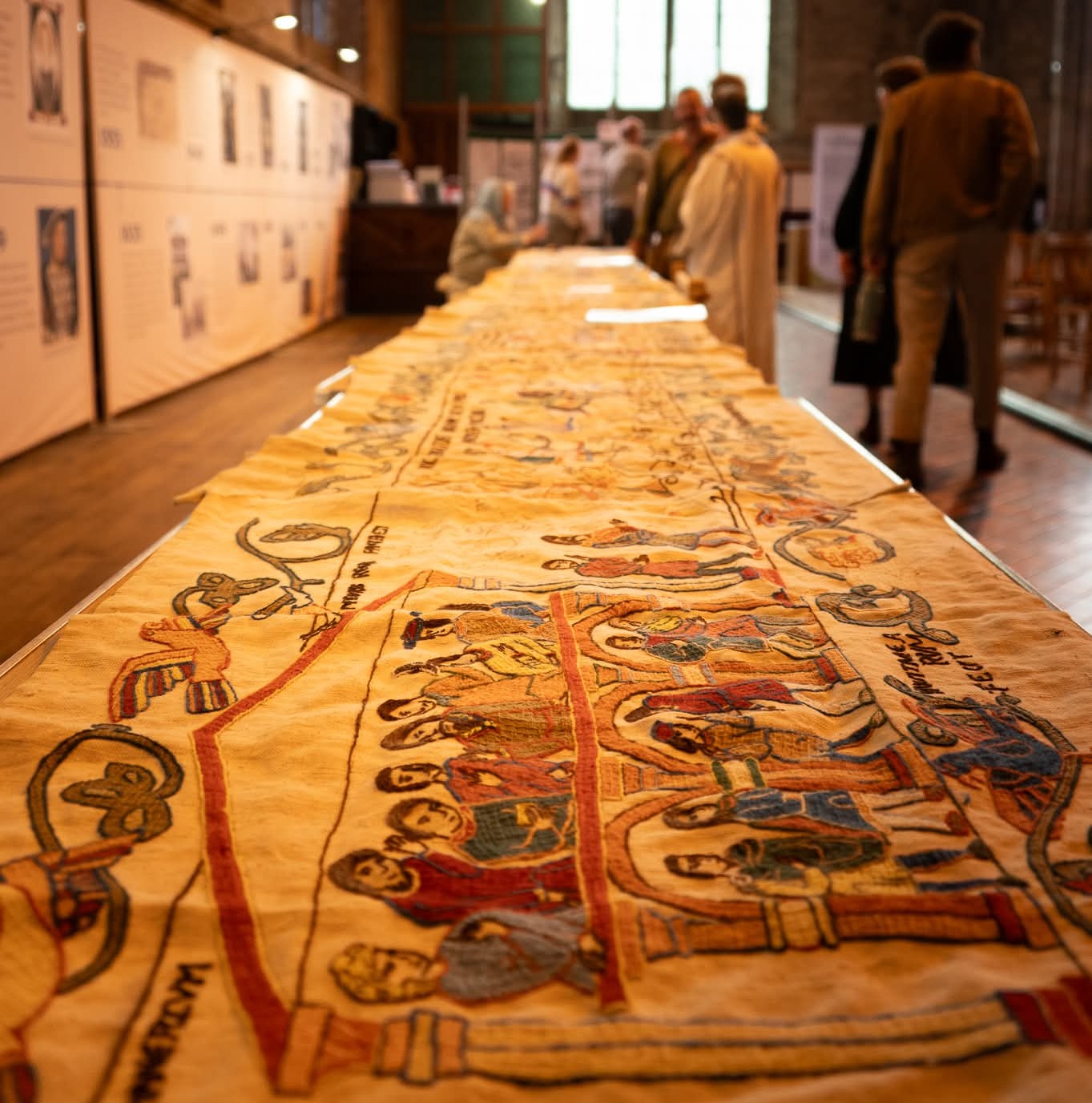 The embroidery being displayed in Leominster Priory in May 2026, when most of the panels were last photographed. – © Jennifer Robinson, 2026
