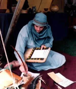 * A lady in a tent doing calligraphy