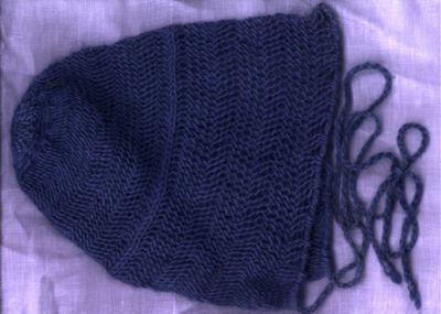 * A hand spun, woad dyed, sprang hairnet